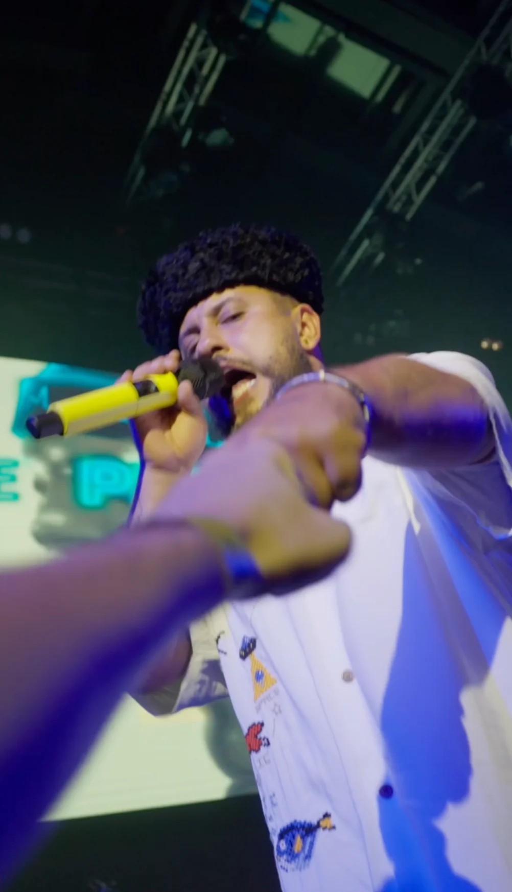 Monatik performing on stage in London, filmed by We Stream